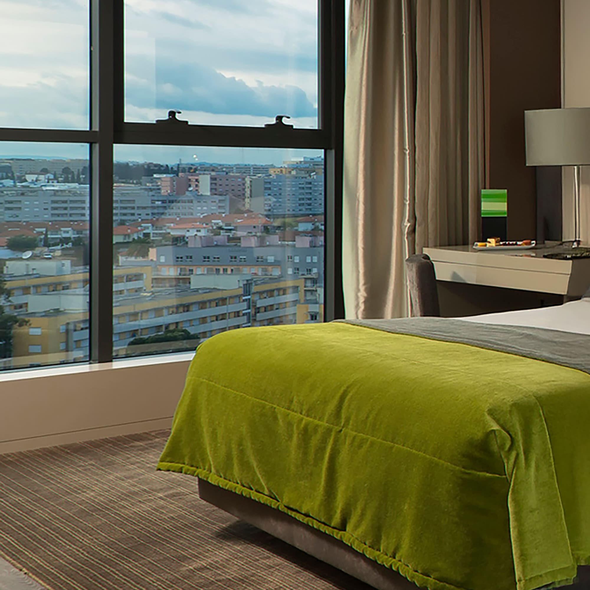 a bedroom with a large window