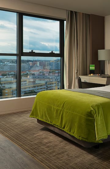 a bedroom with a large window