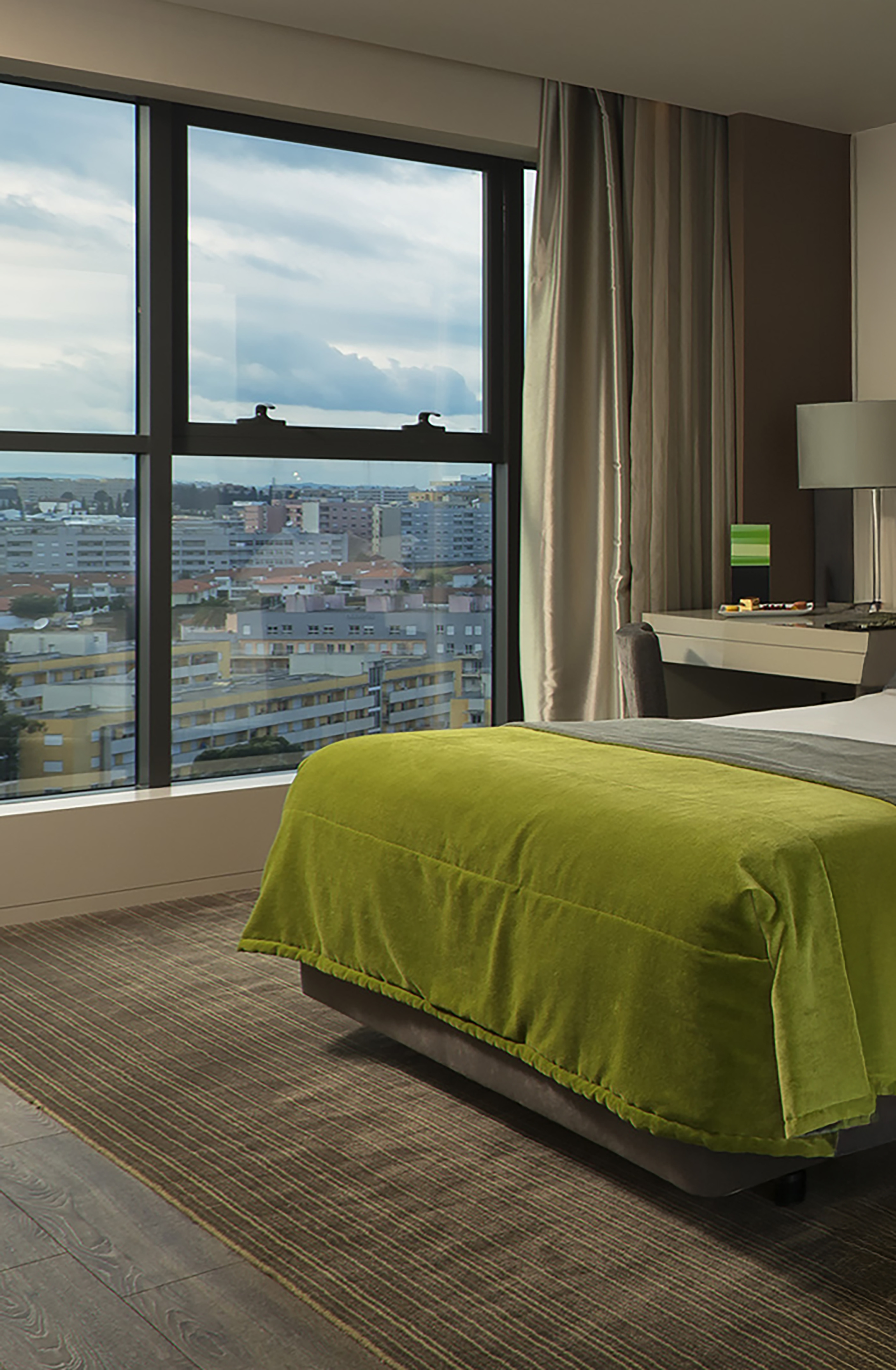 a bedroom with a large window