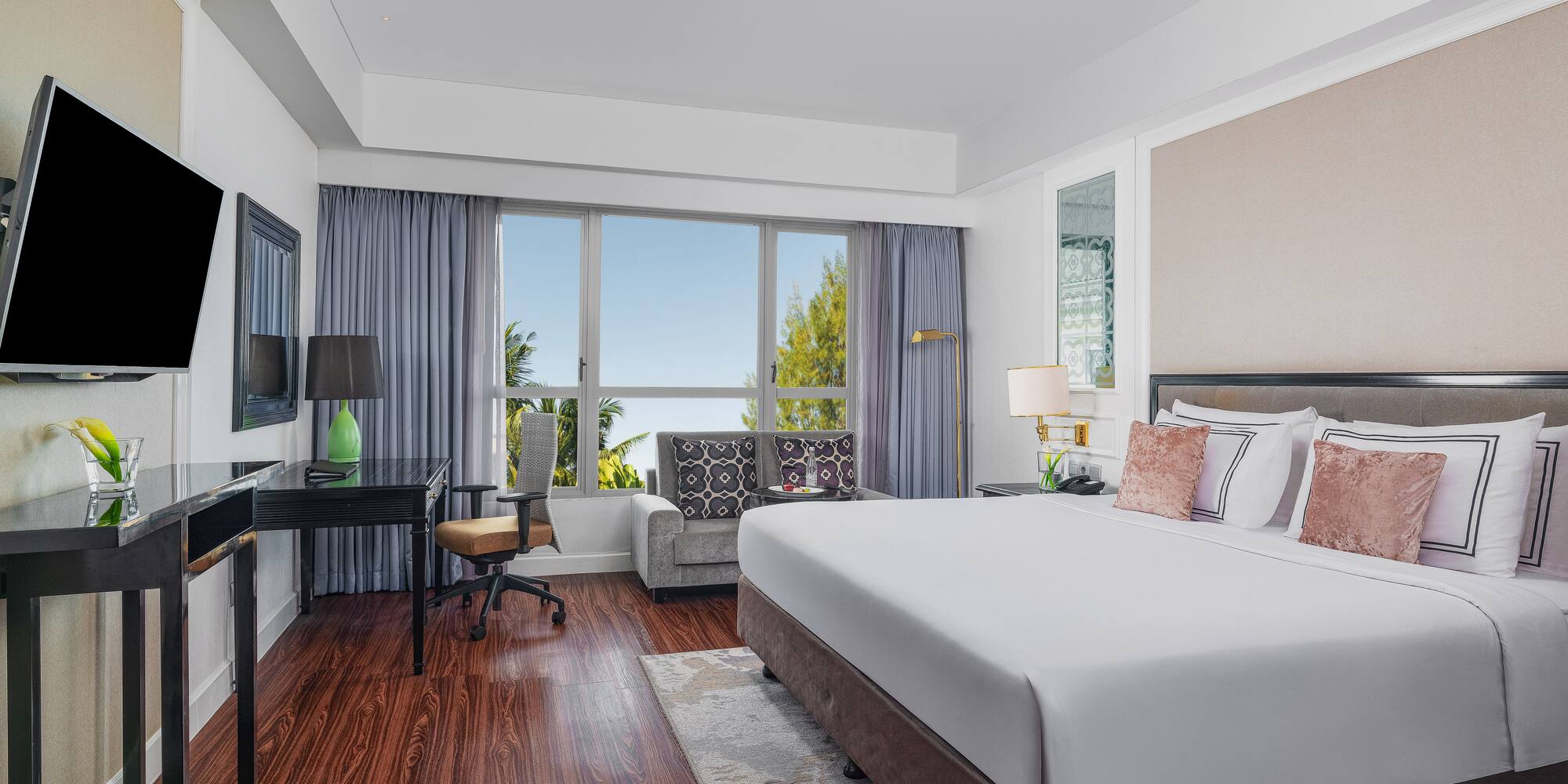 a room with a bed and a desk and a chair