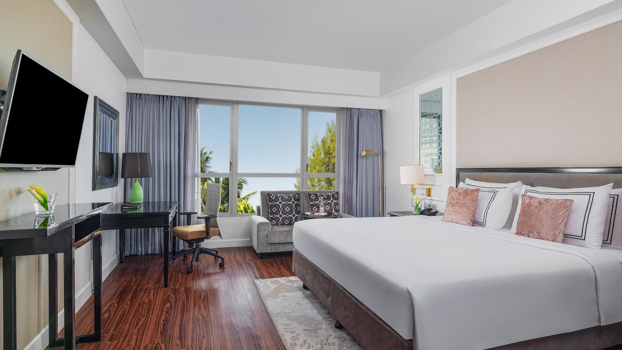 a room with a bed and a desk and a chair