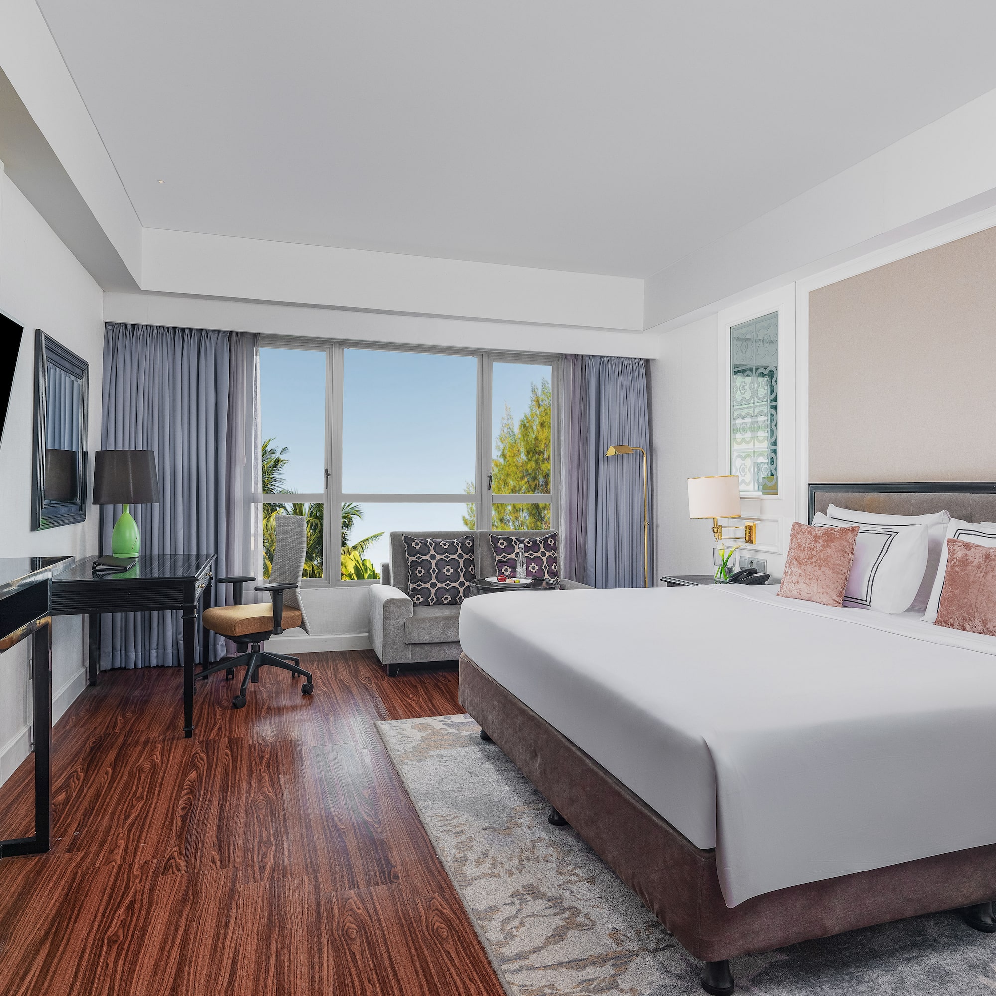 a room with a bed and a desk and a chair