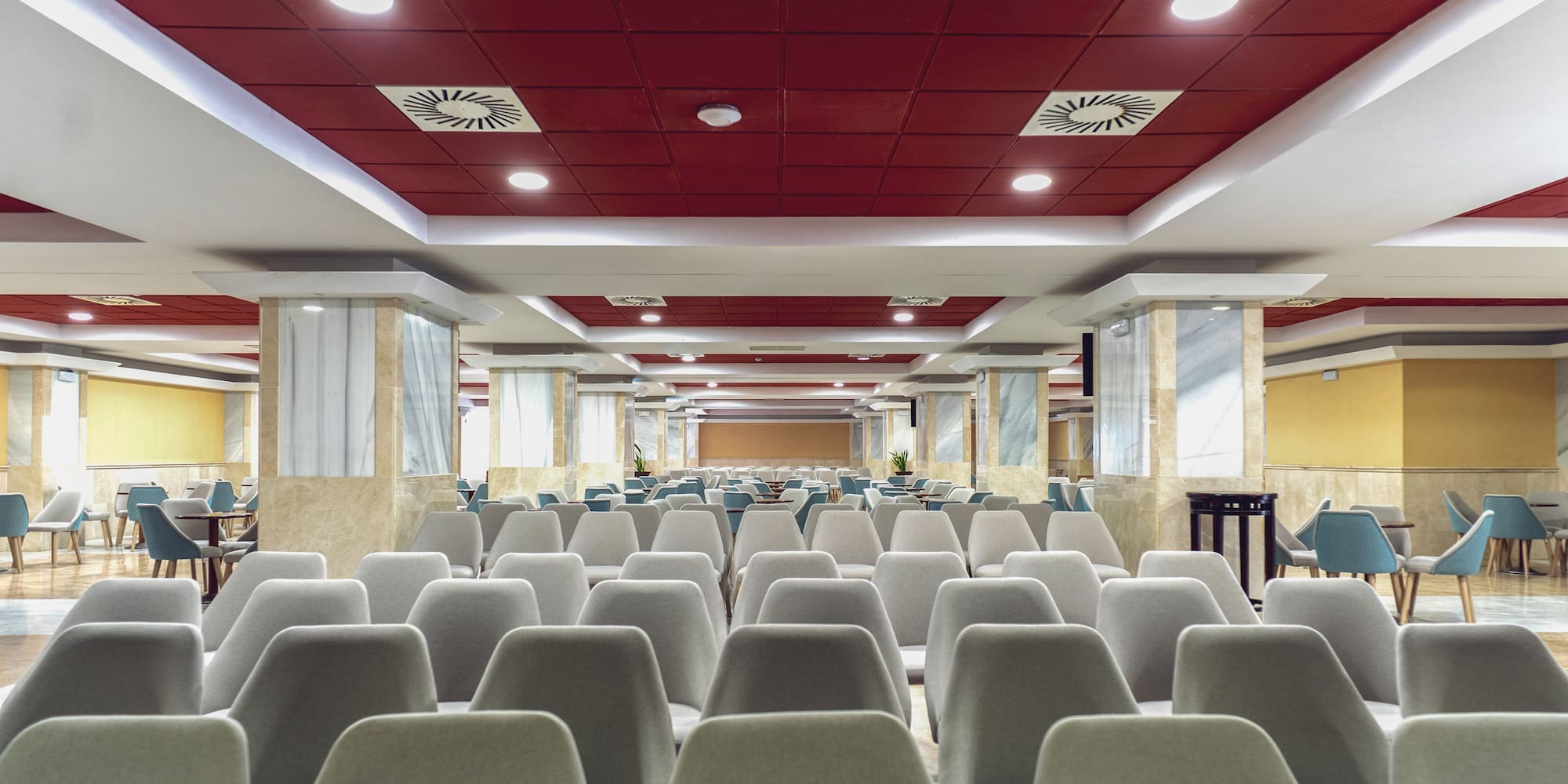 a room with chairs and tables