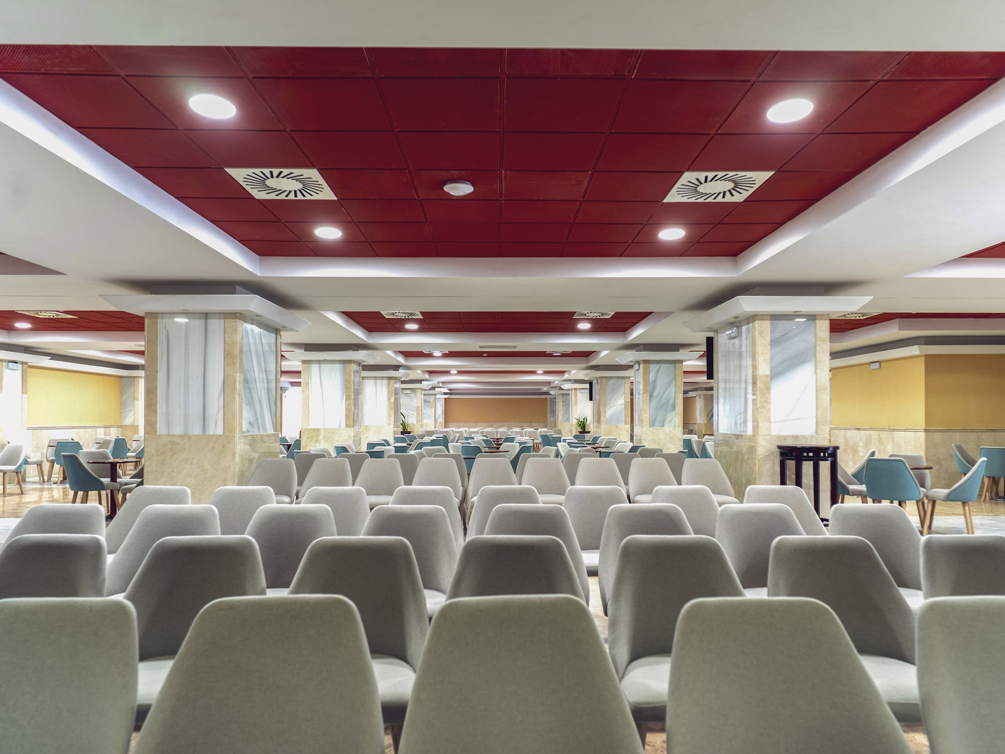 a room with chairs and tables