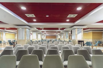 a room with chairs and tables