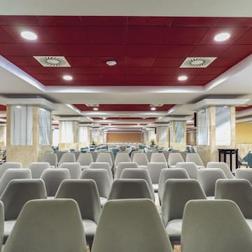 a room with chairs and tables