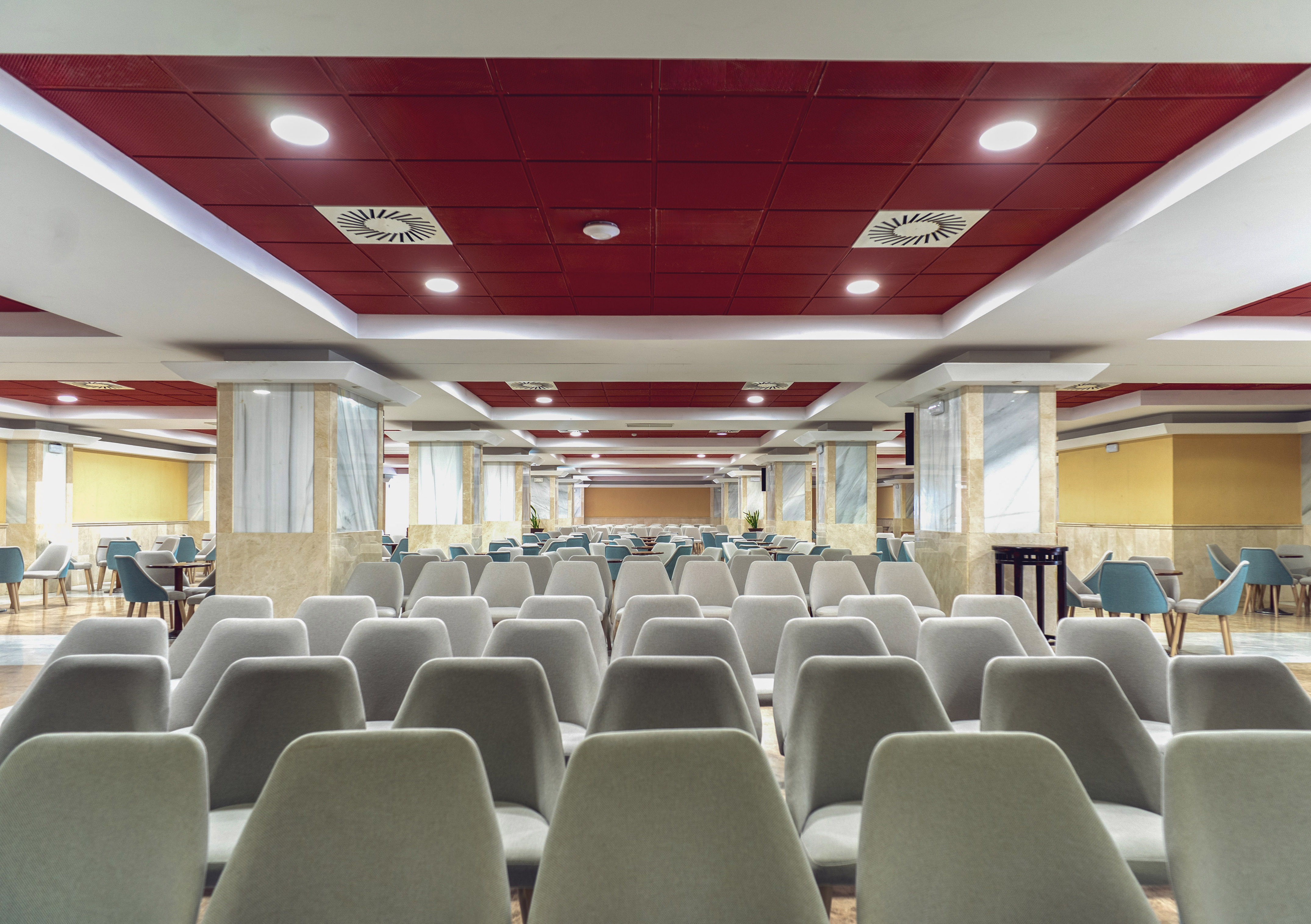 a room with chairs and tables