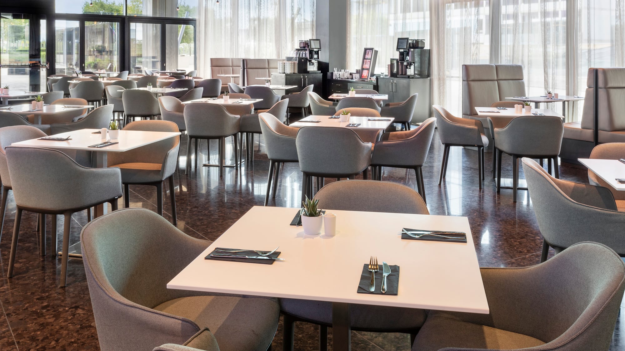 a room with tables and chairs