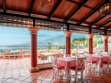 a restaurant with tables and chairs