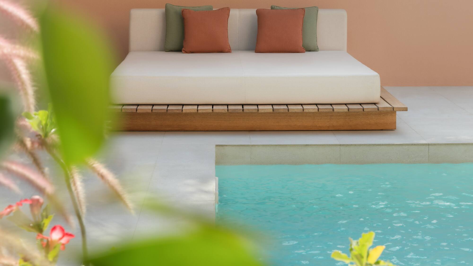 a bed next to a pool