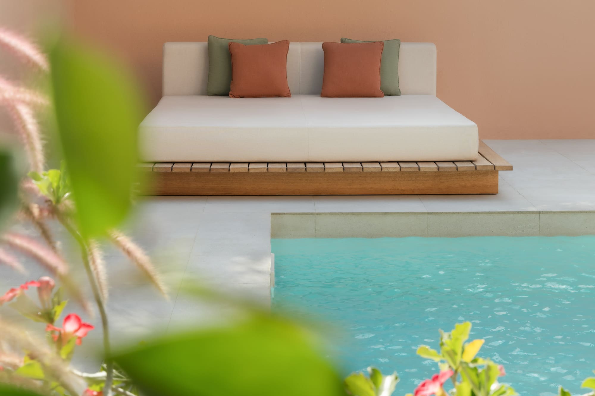 a bed next to a pool