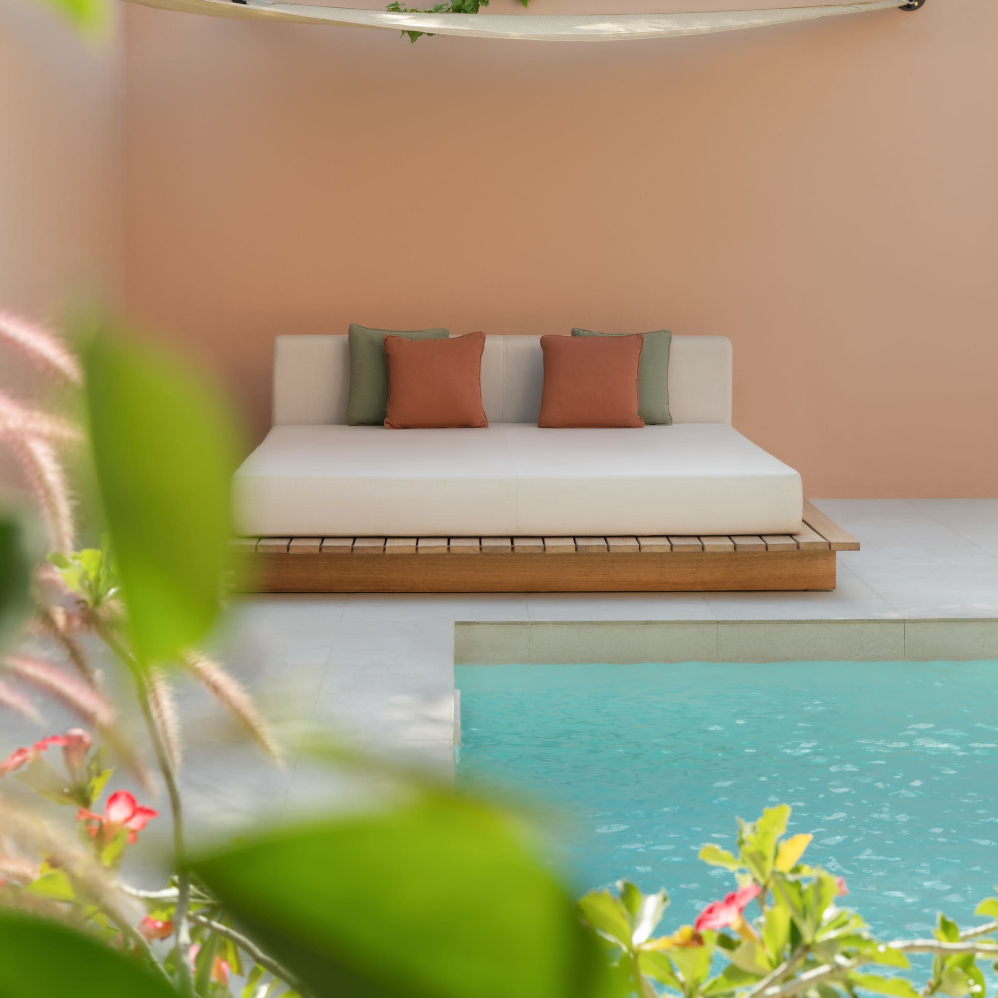 a bed next to a pool