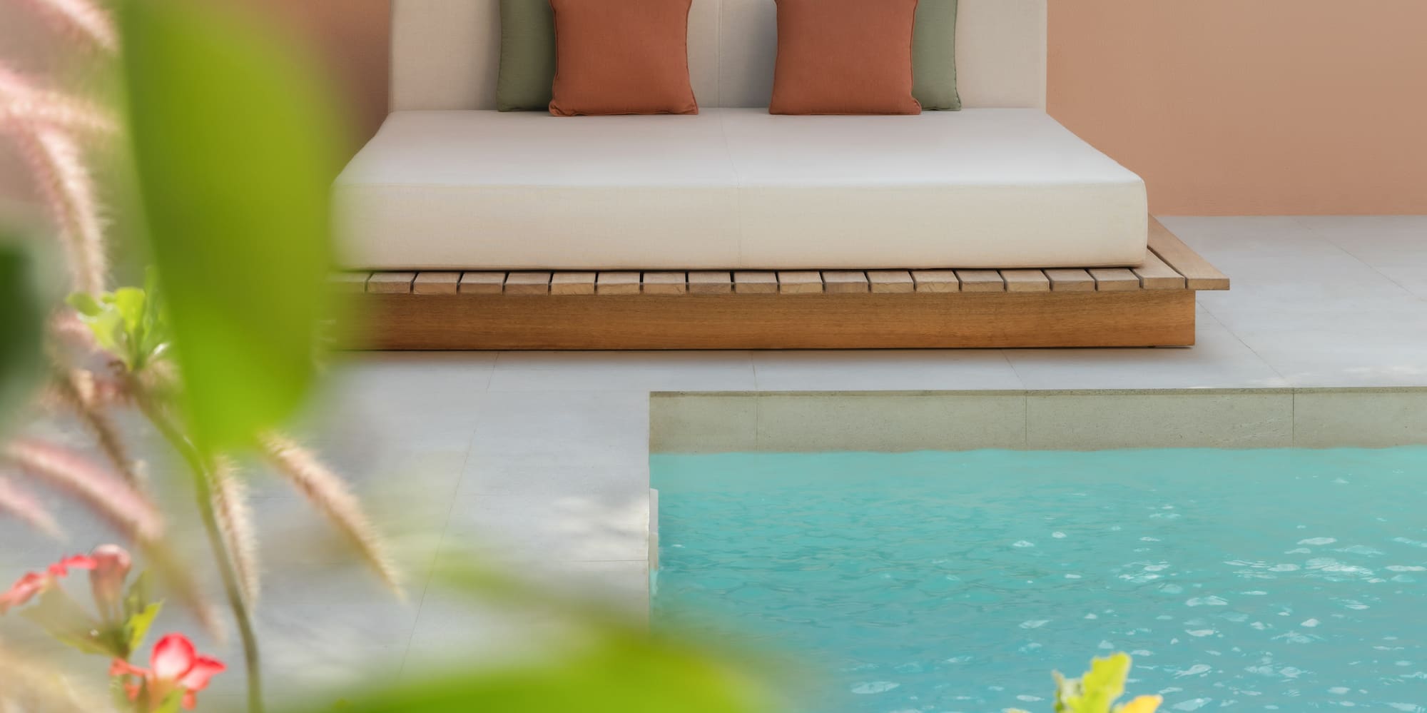 a bed next to a pool