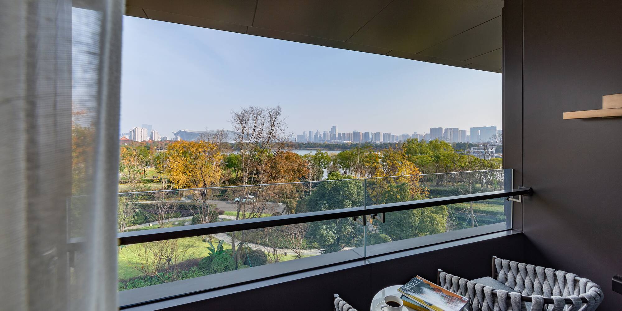 a balcony with a view of a city and a river