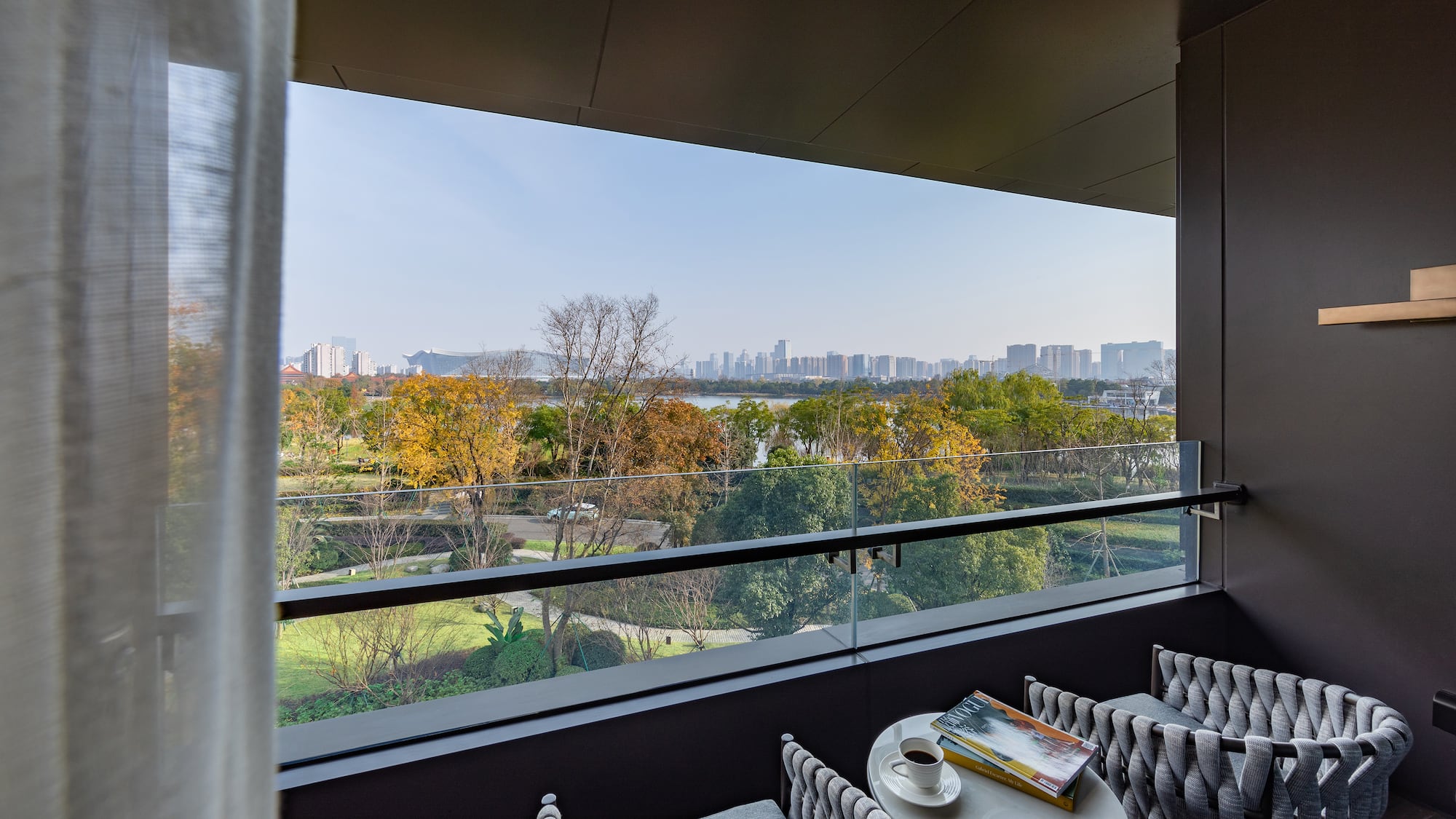 a balcony with a view of a city and a river