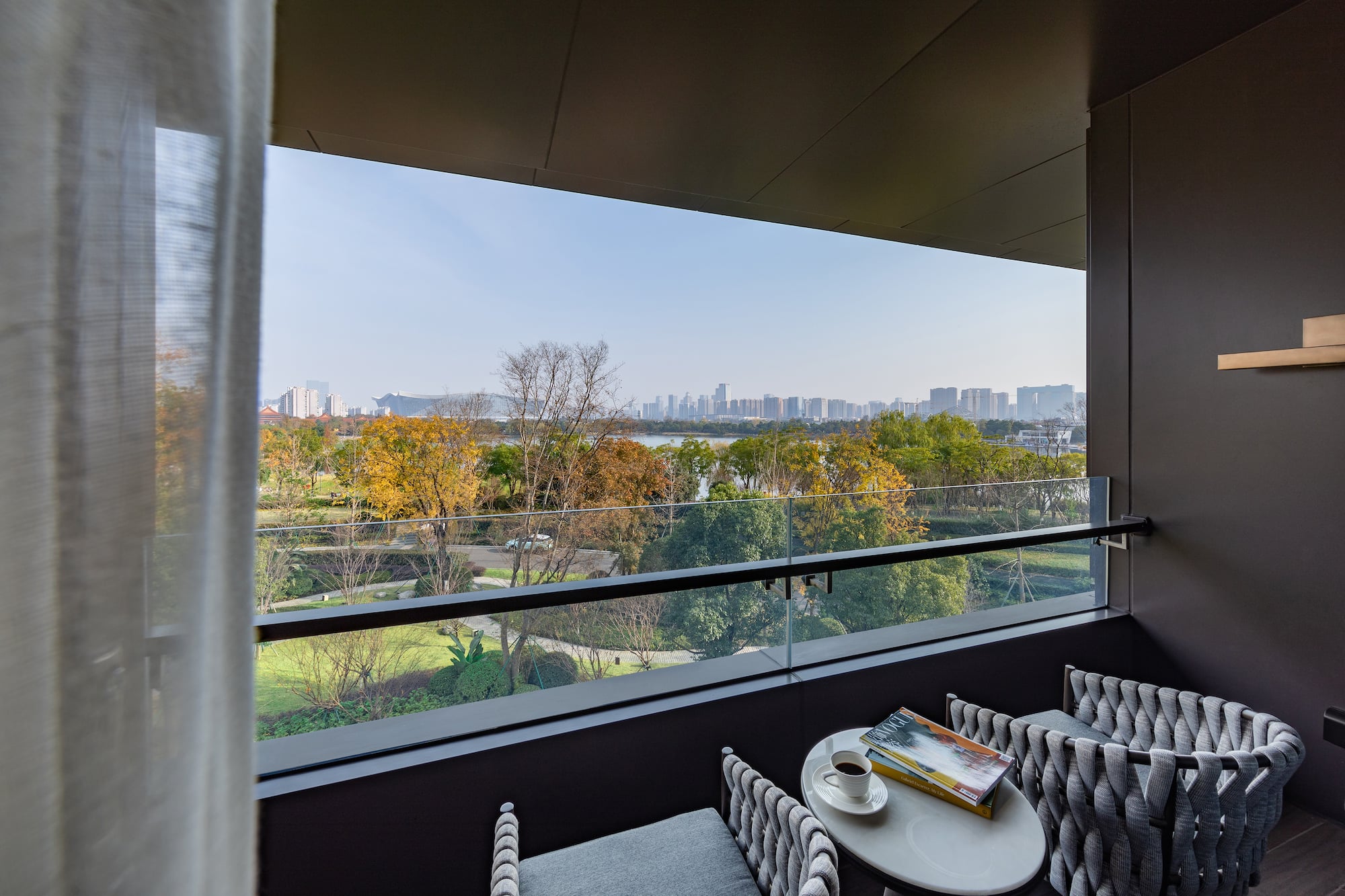 a balcony with a view of a city and a river