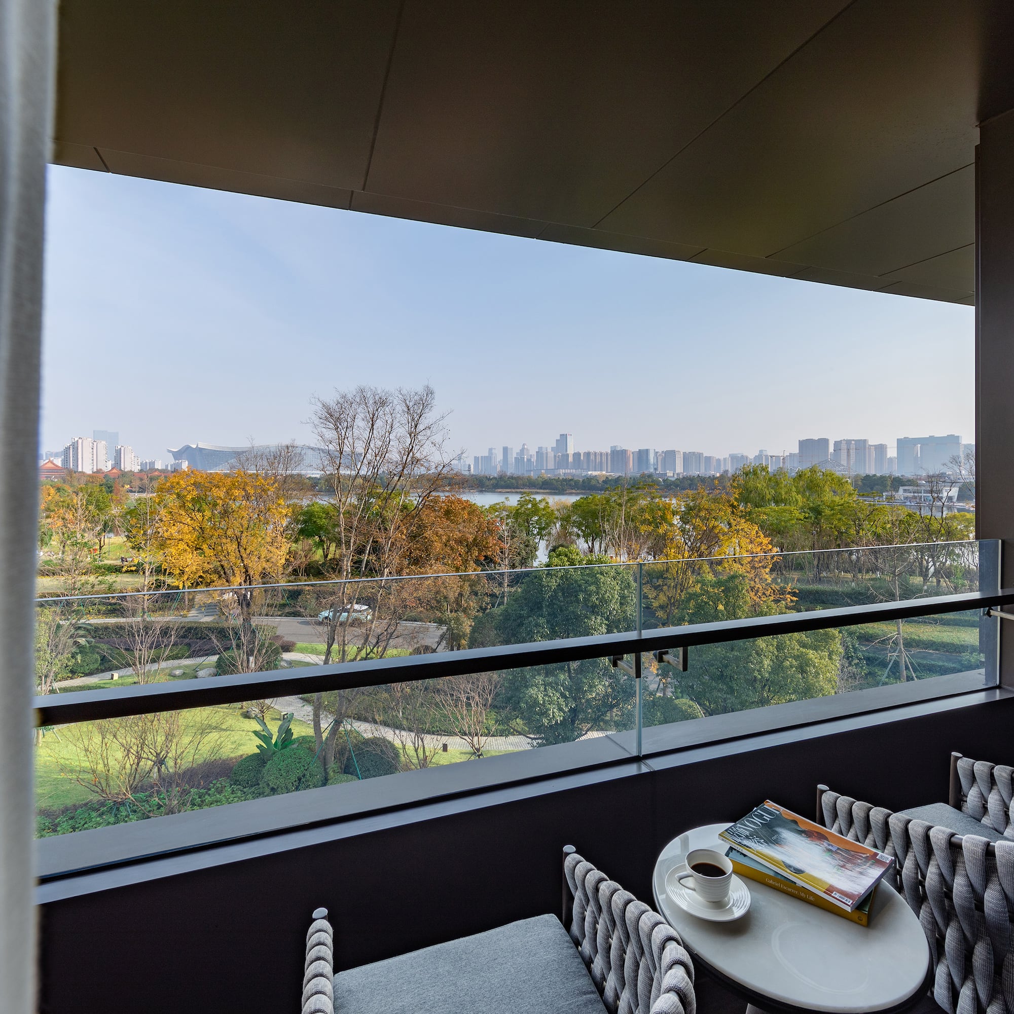 a balcony with a view of a city and a river