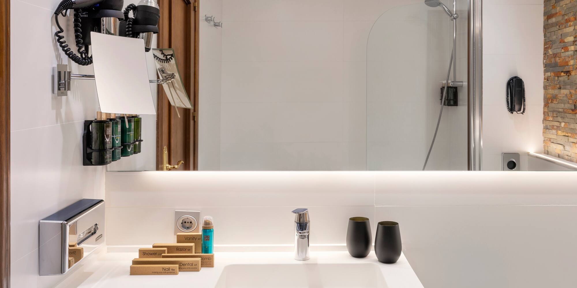 a bathroom with a mirror and sink