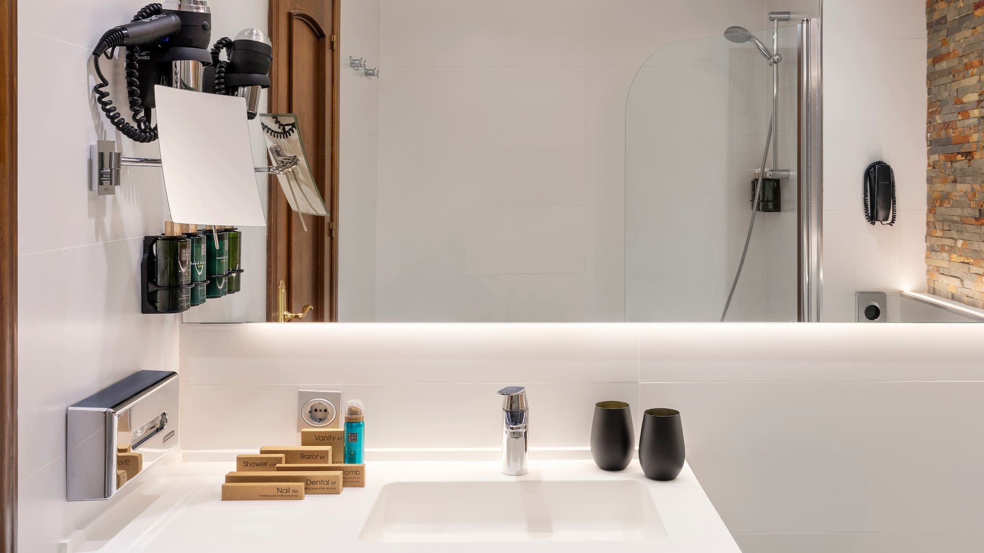 a bathroom with a mirror and sink