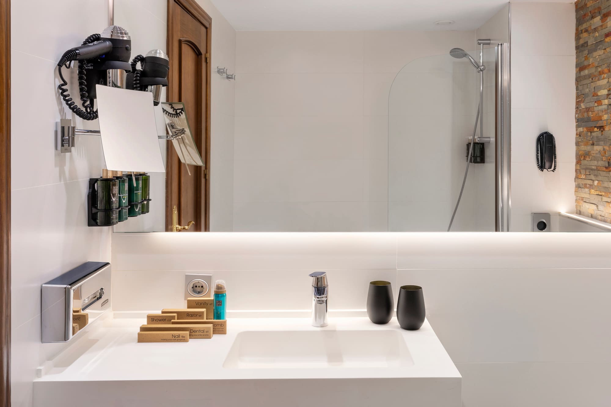 a bathroom with a mirror and sink