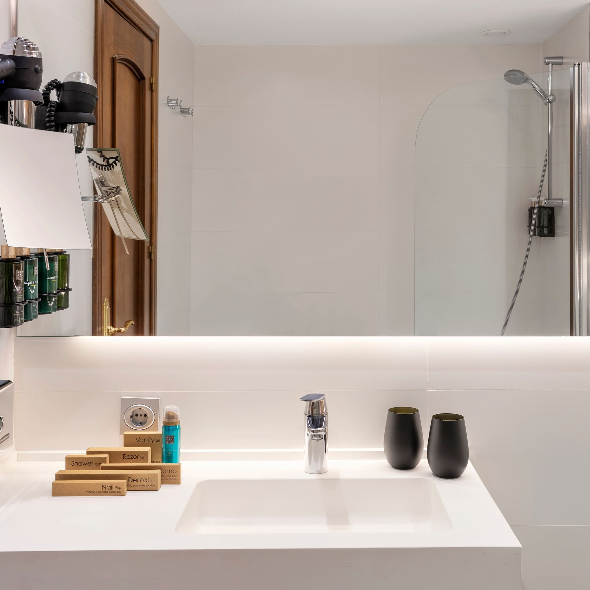 a bathroom with a mirror and sink