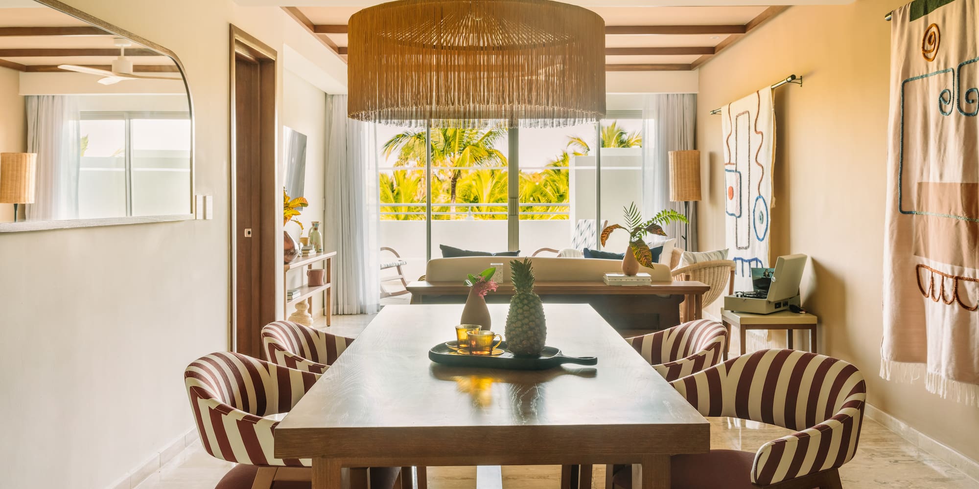 a dining room with a table and chairs