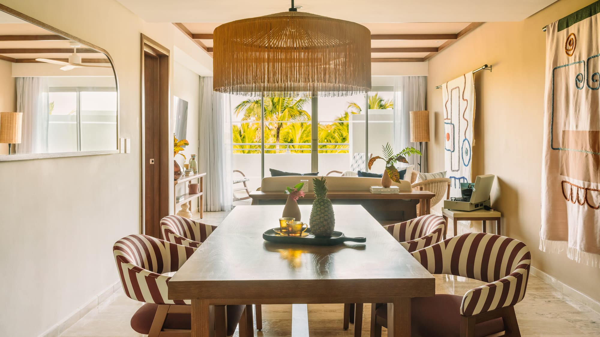 a dining room with a table and chairs