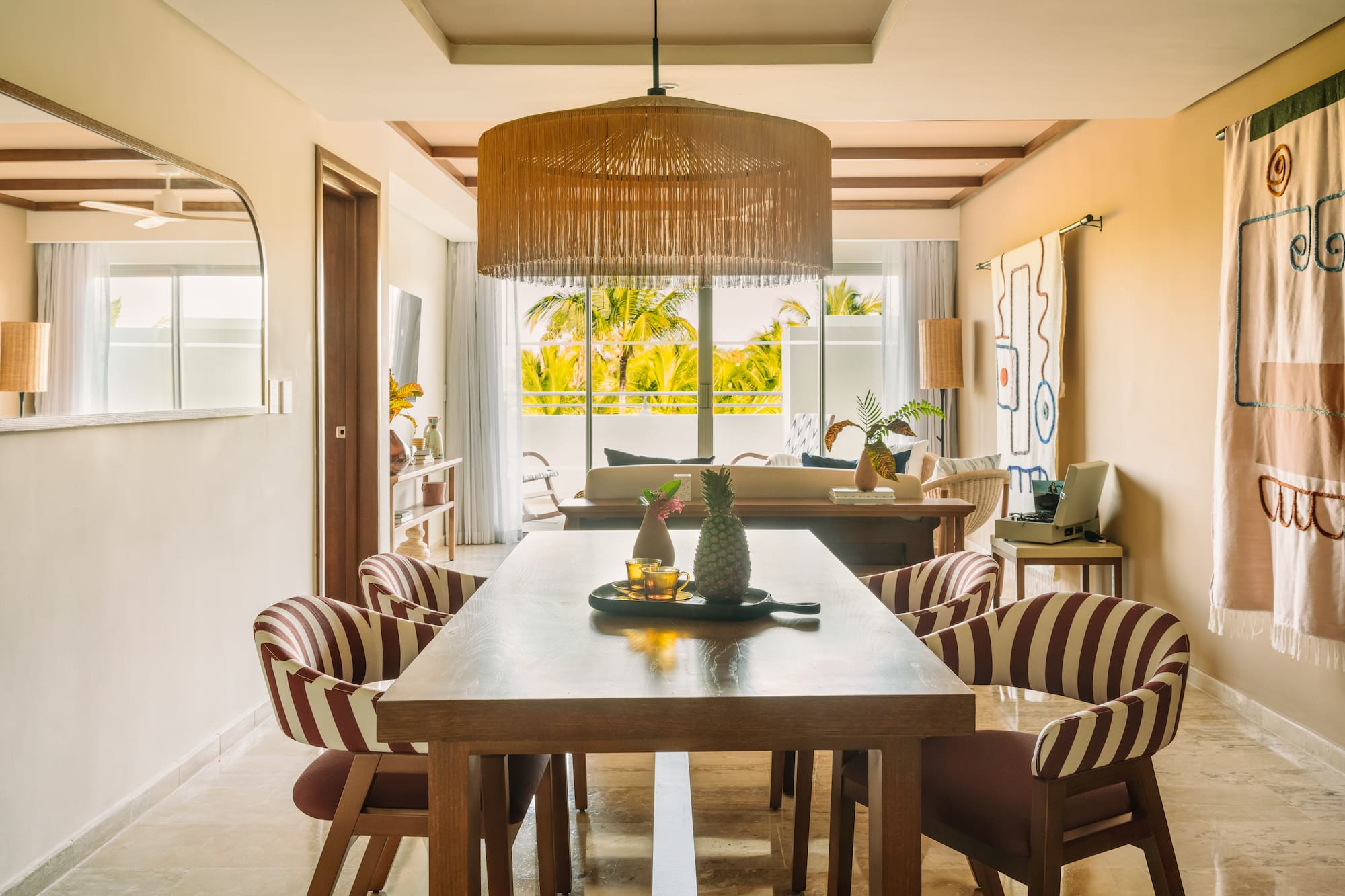 a dining room with a table and chairs