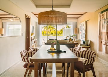 a dining room with a table and chairs