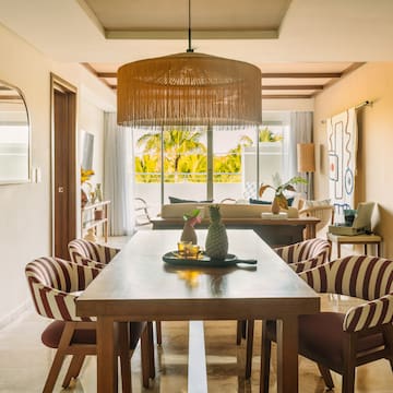 a dining room with a table and chairs
