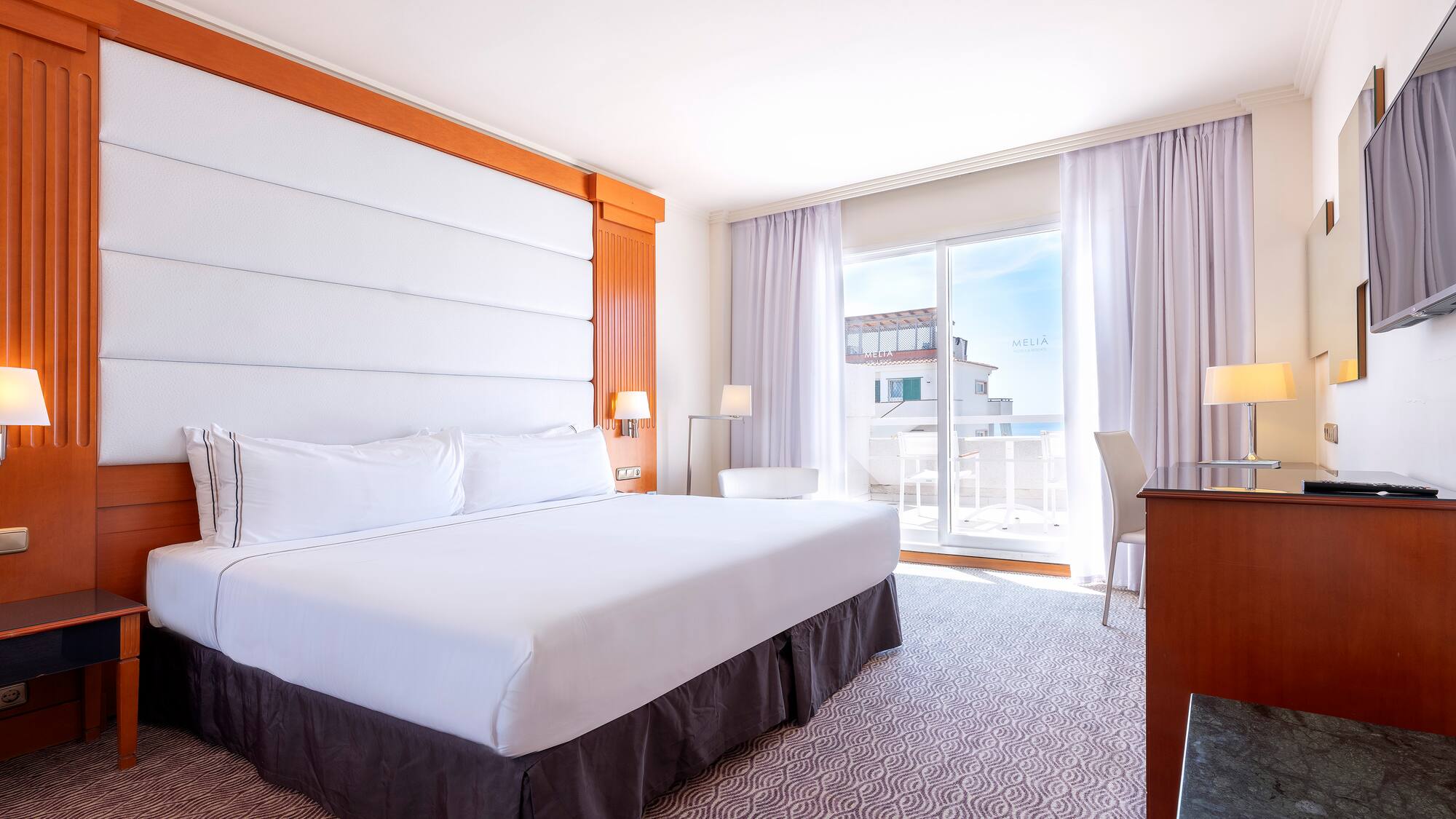 a room with a bed and a desk