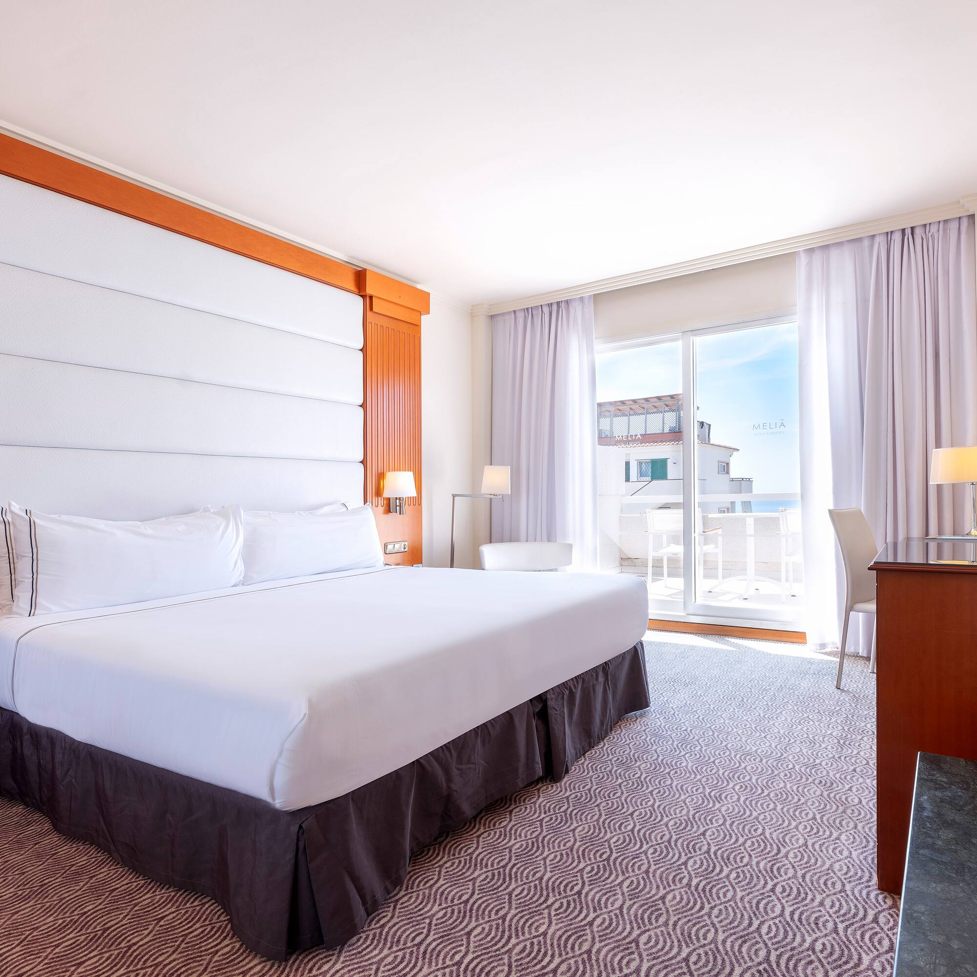 a room with a bed and a desk