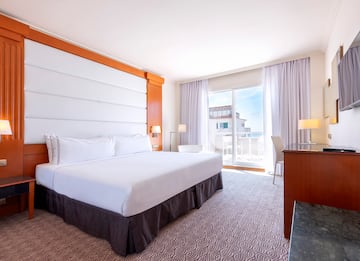 a room with a bed and a desk