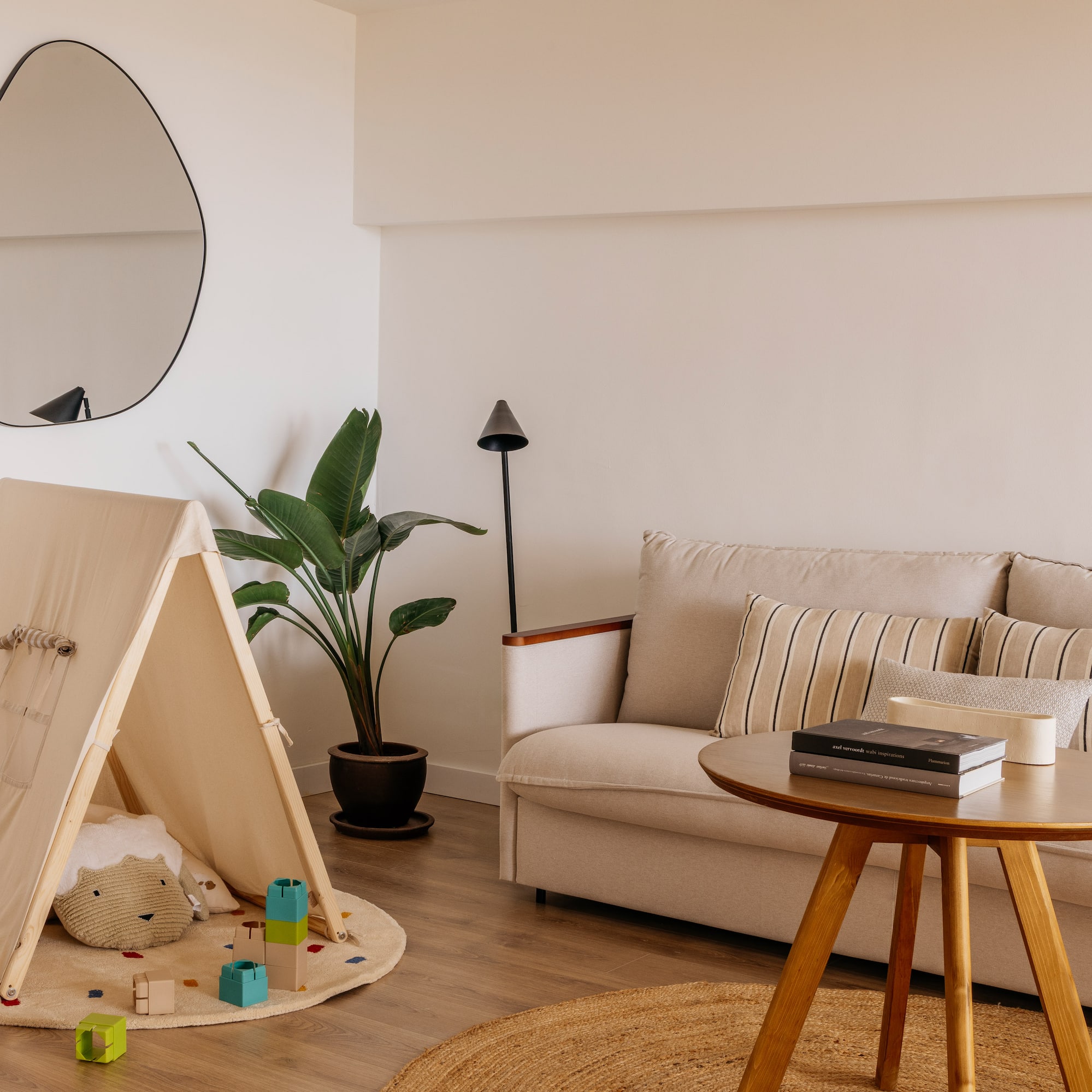 a room with a couch and a play tent