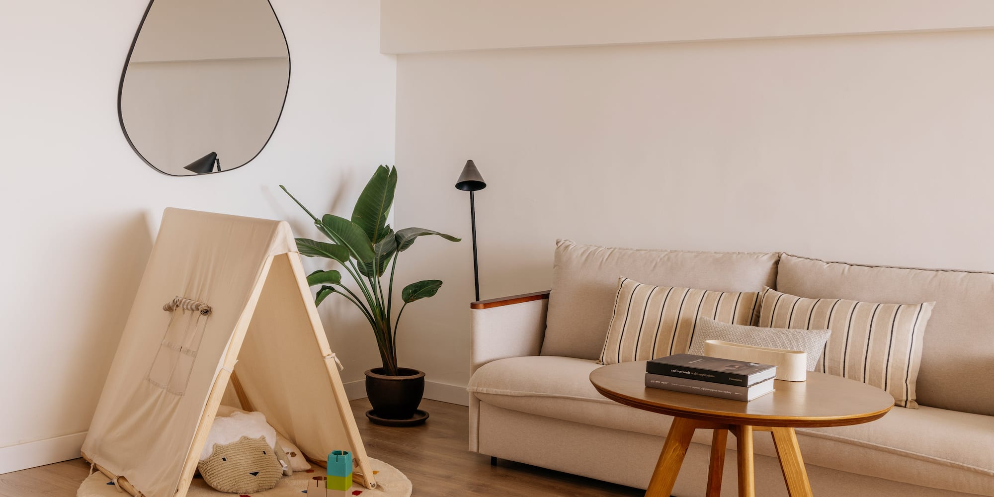 a room with a couch and a play tent