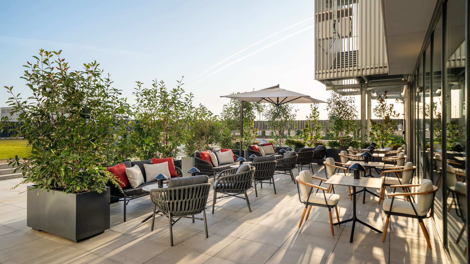 a patio with chairs and tables