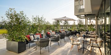 a patio with chairs and tables