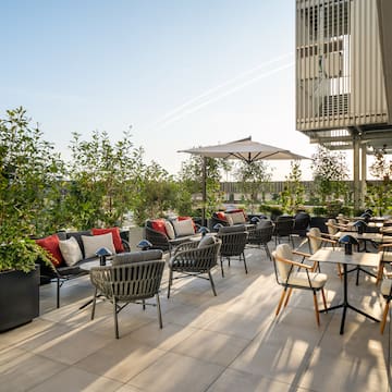 a patio with chairs and tables