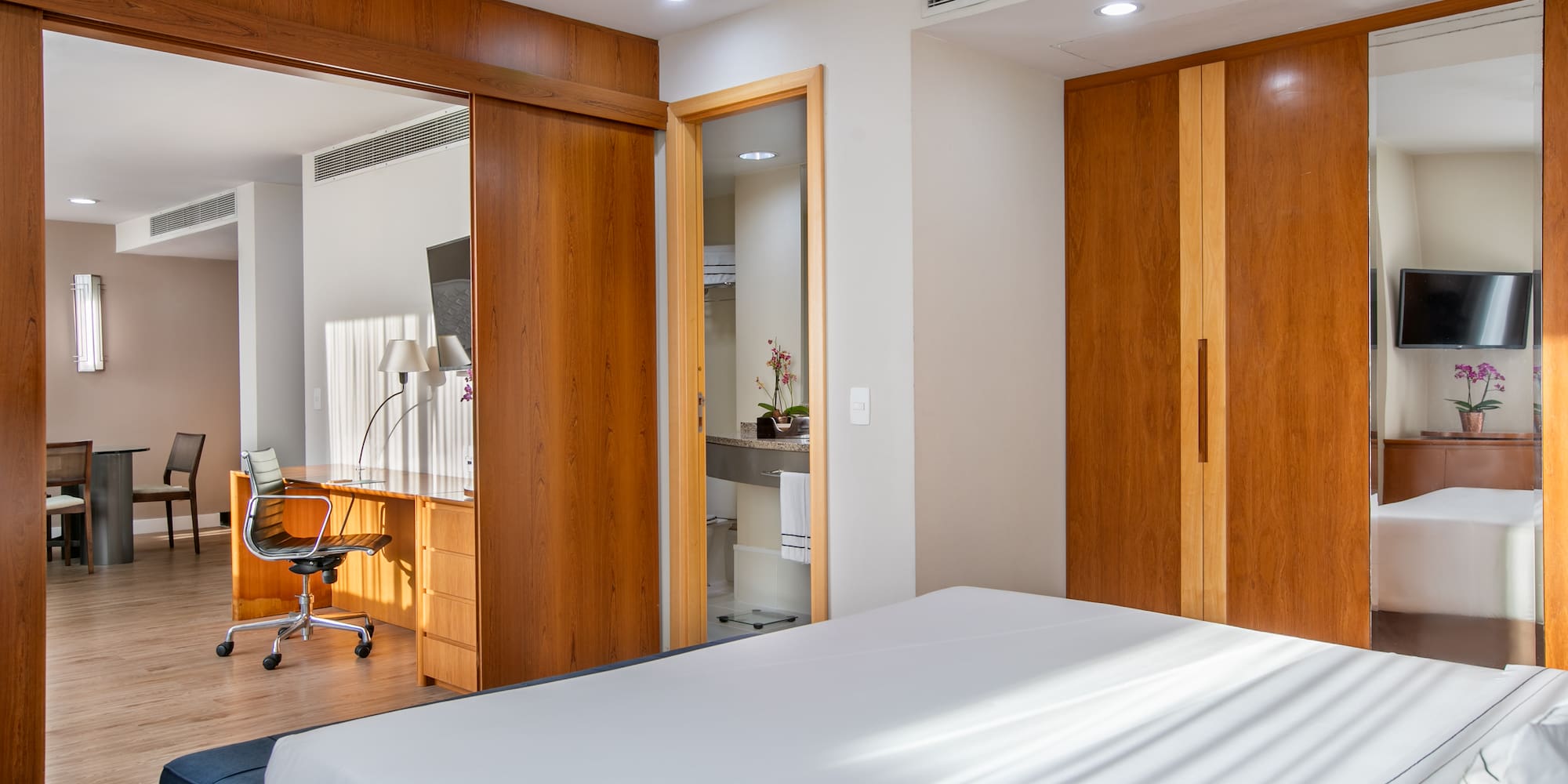 a bedroom with a bed and a desk