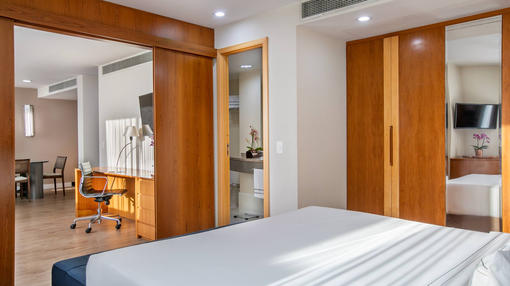 a bedroom with a bed and a desk