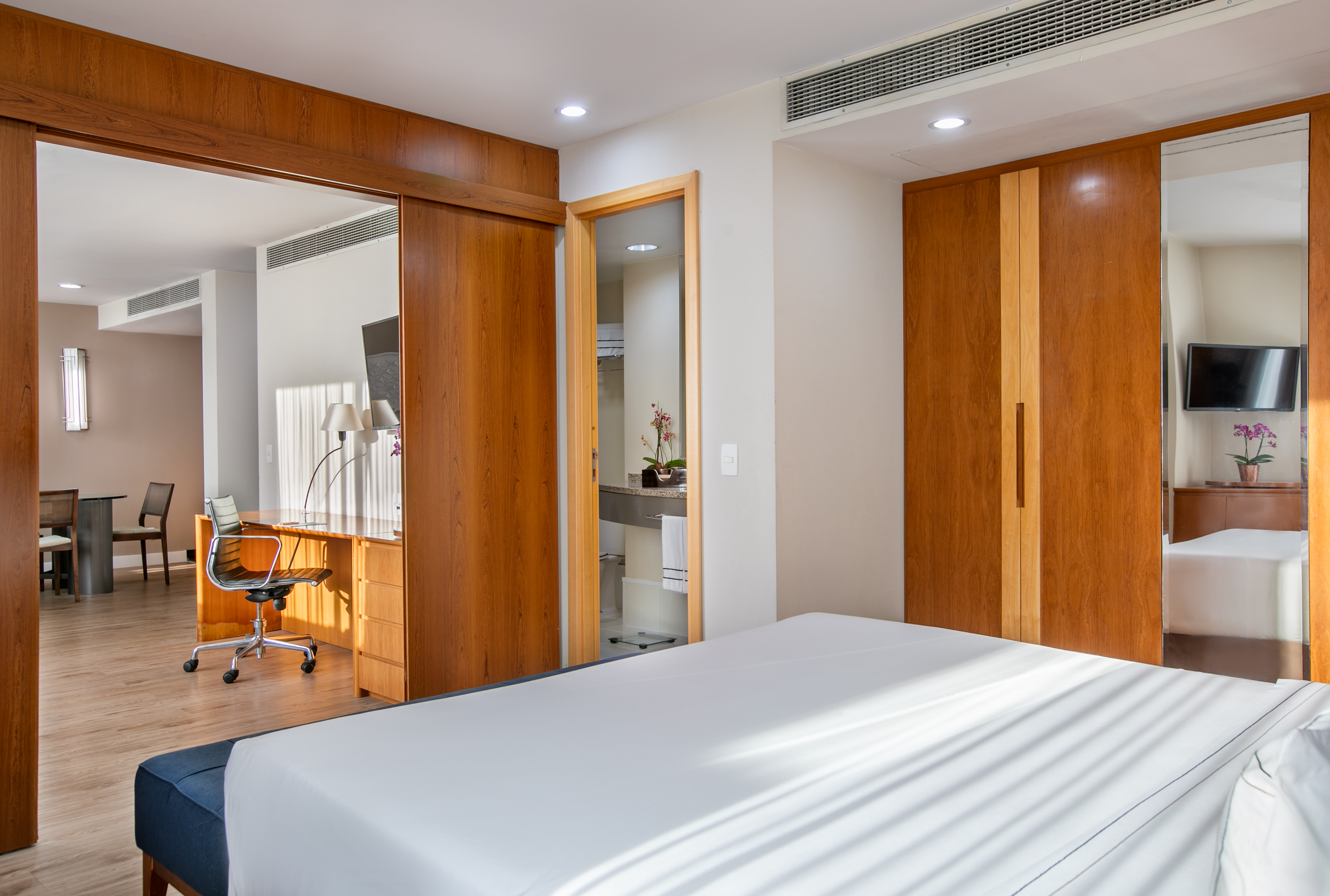 a bedroom with a bed and a desk