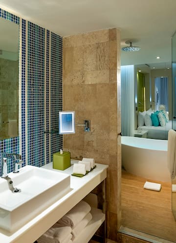 a bathroom with a tub and sink