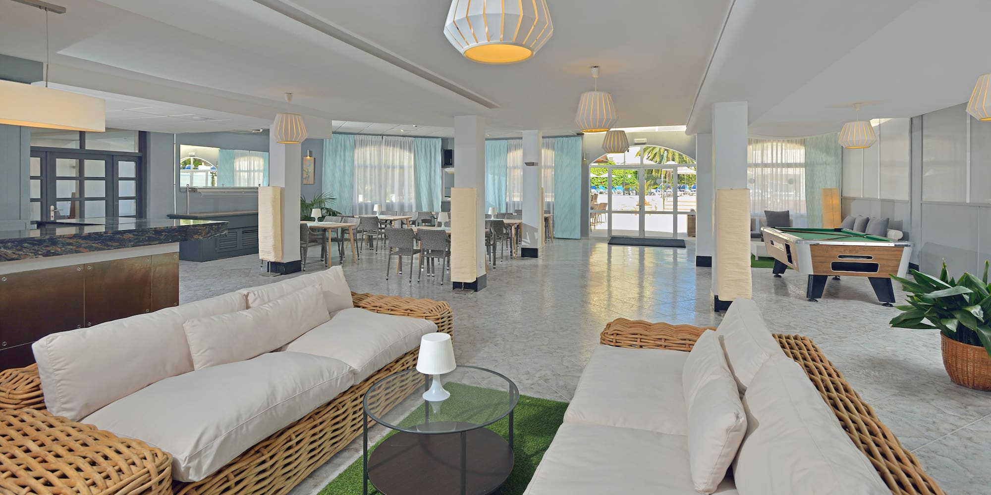 a room with a couch and tables