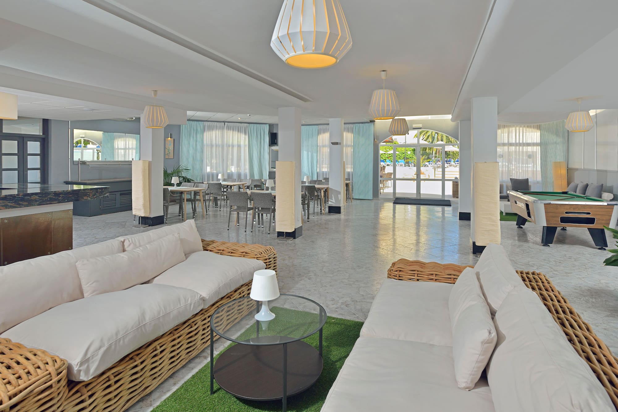 a room with a couch and tables