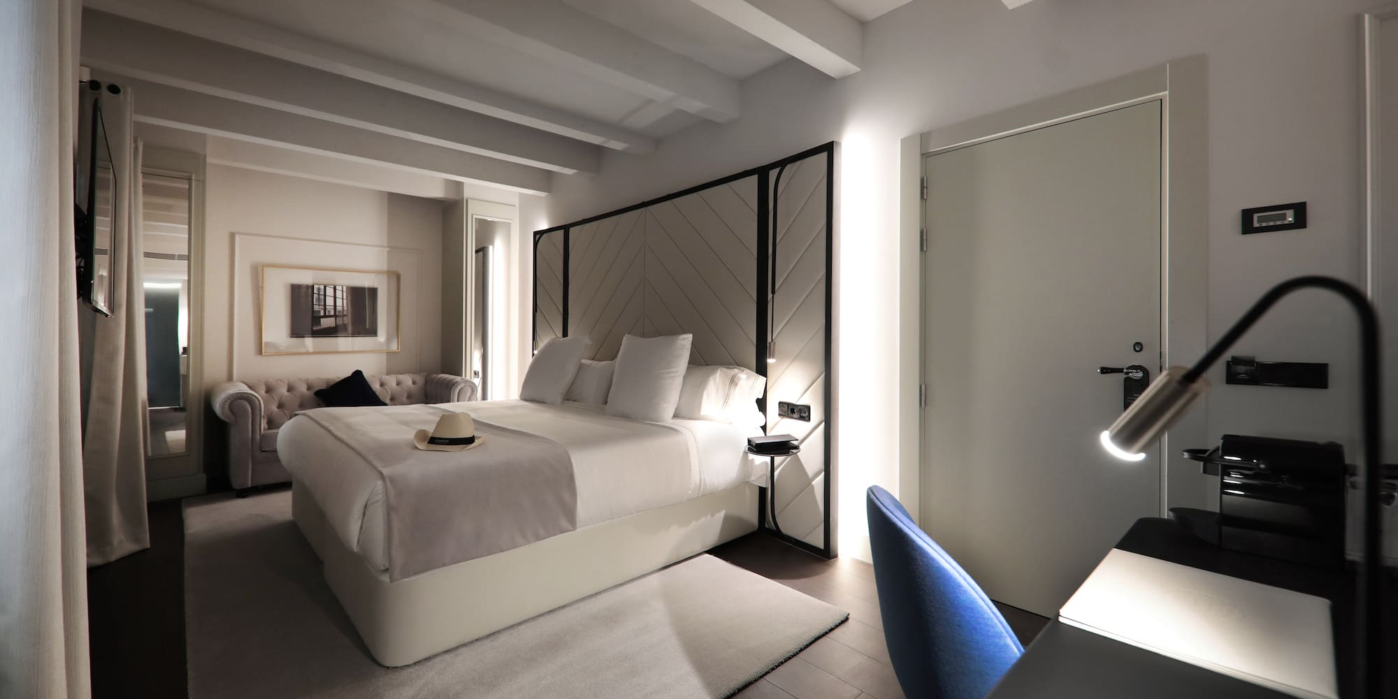 a room with a bed and a chair