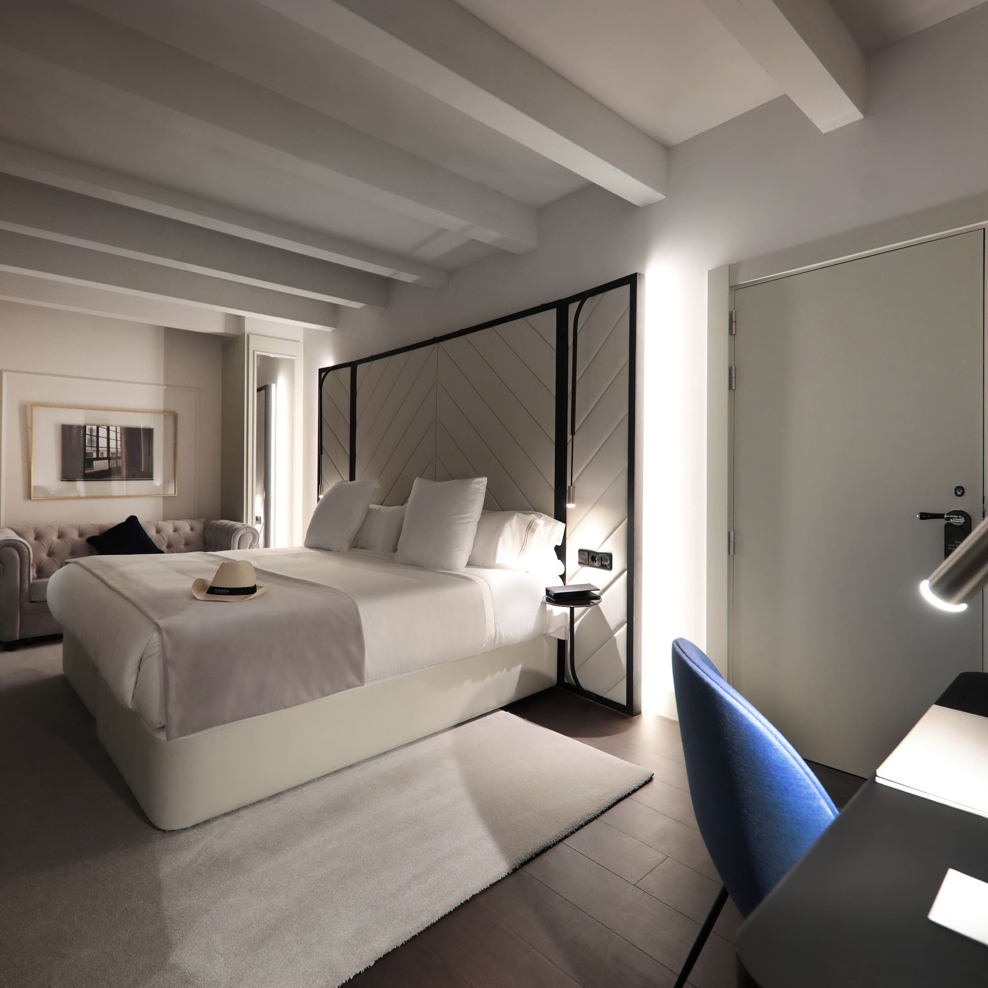 a room with a bed and a chair