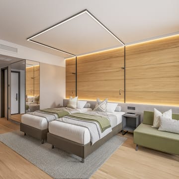 a room with a wood wall and a glass door