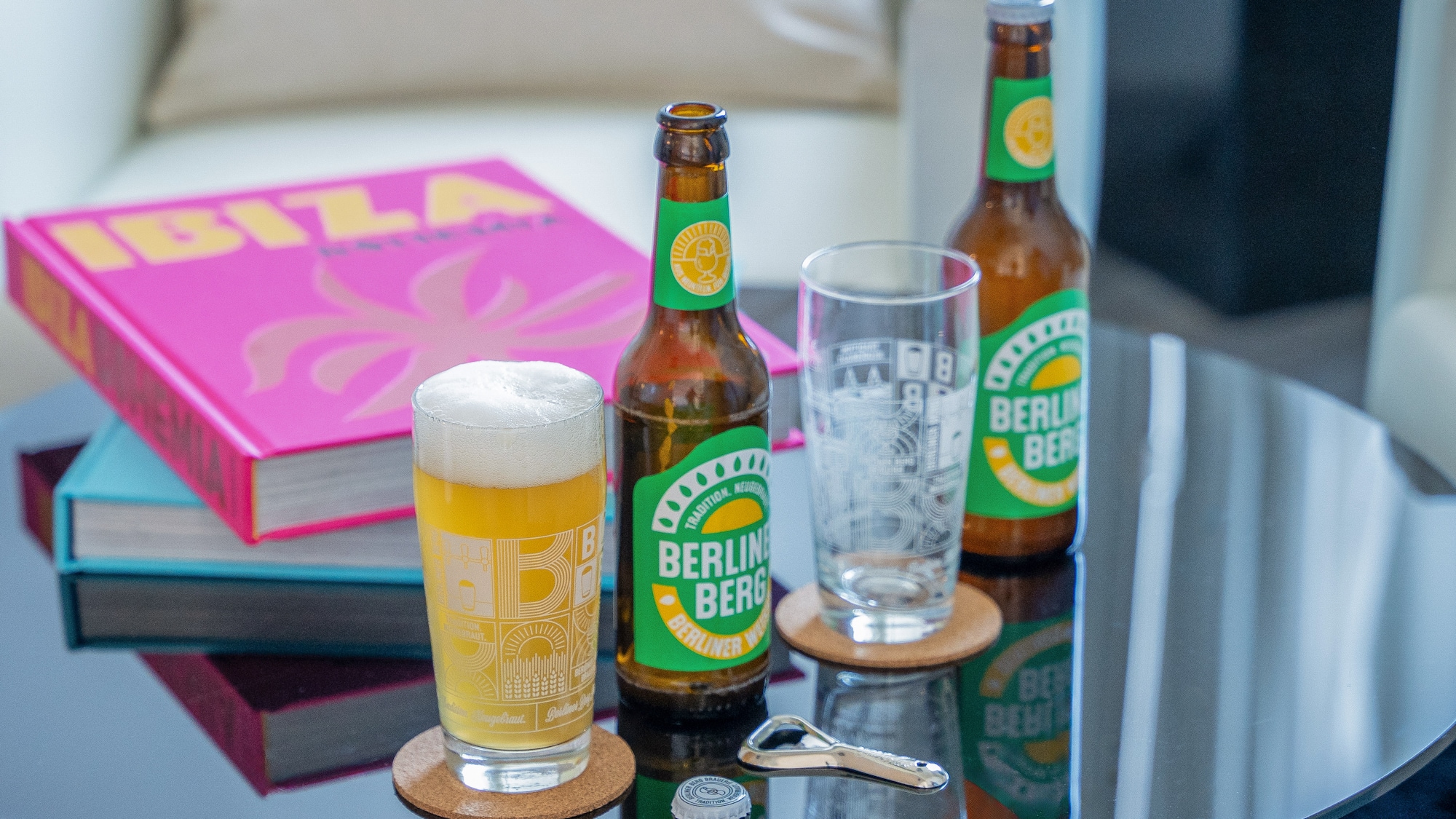 a group of beer bottles and glasses on a table