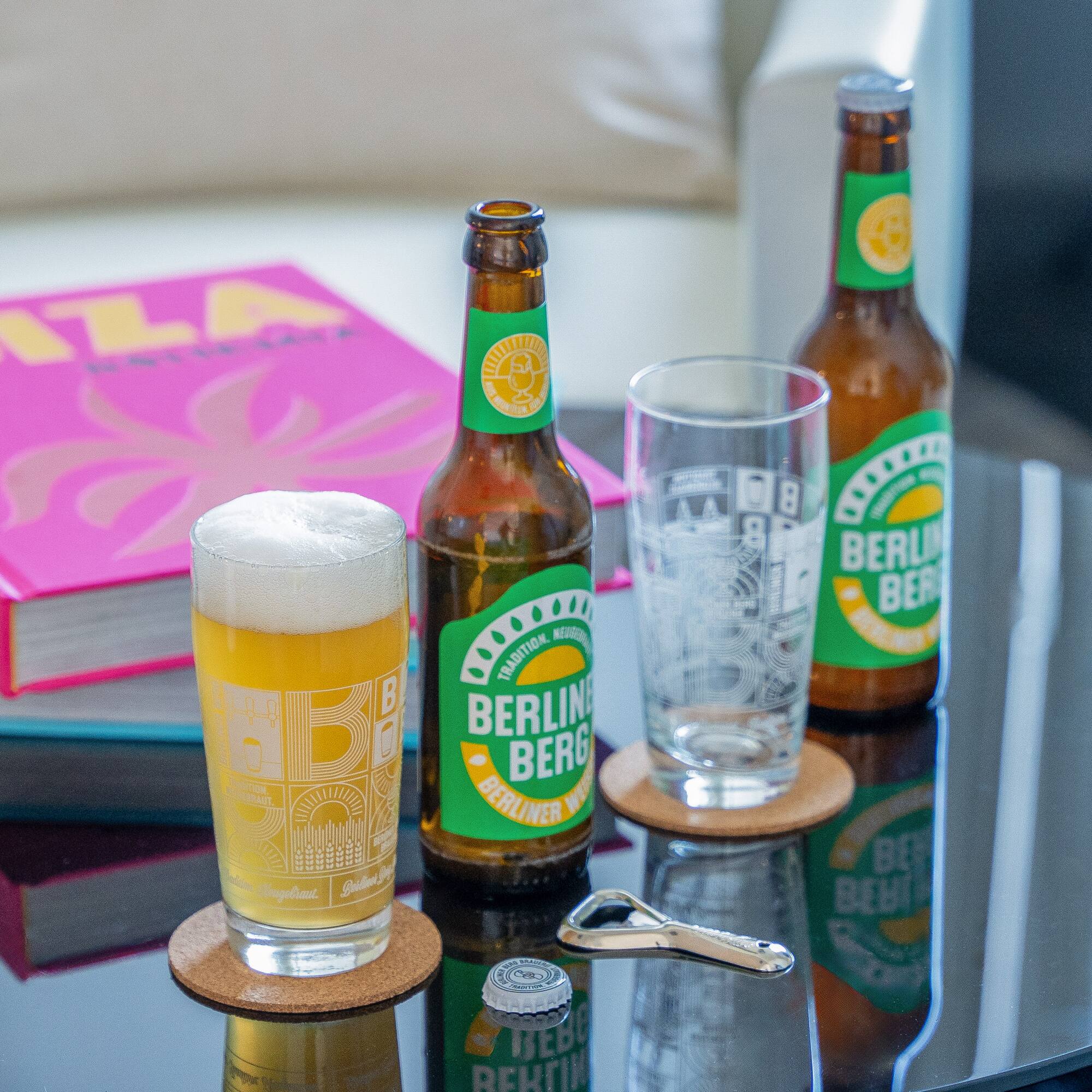 a group of beer bottles and glasses on a table