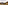 a town on a hillside with mountains in the background